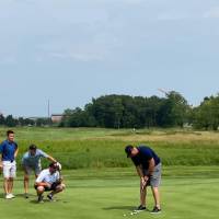 four alumni on the course
